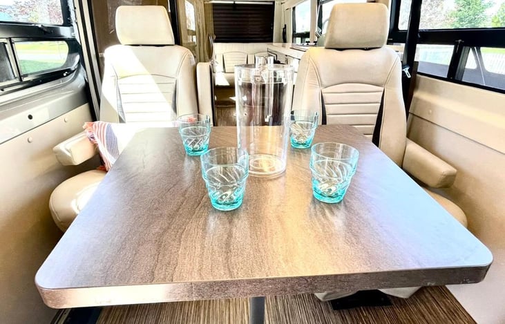 Front table seating. all 4 captains' chairs rotate to be able to accommodate the table.