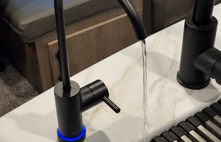 At source water filter with YV filtered drinking water facet in kitchen island.