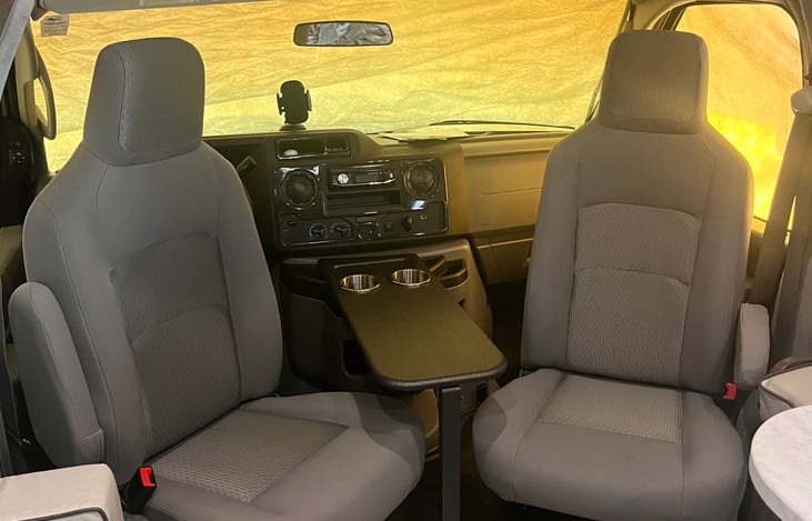 Swivel chairs to add more seating in living area while parked.