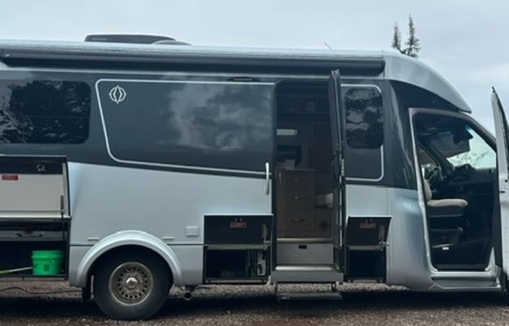 Lots of storage, outside table and awning on passenger's side.