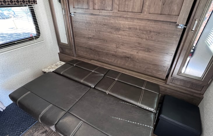 To convert it into a bed, flatten the couch (Step 1)