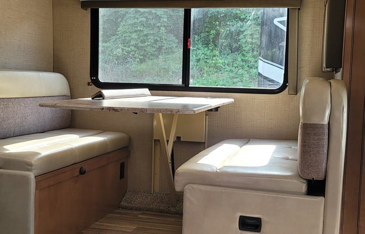 Dinette which converts into a queen bed.