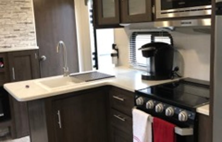 Fully stocked kitchen, including keurig coffee maker.