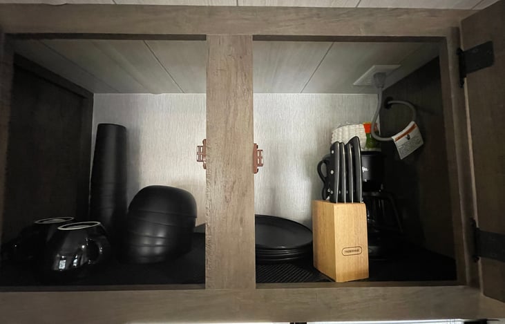 Plates, mugs, cups, knives, and coffee maker all included with the stay.