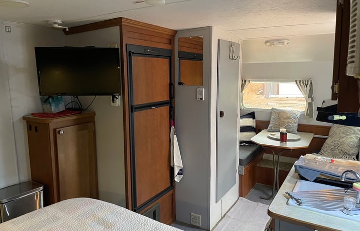 Full sized RV Fridge with Freezer, TV, Dining table.