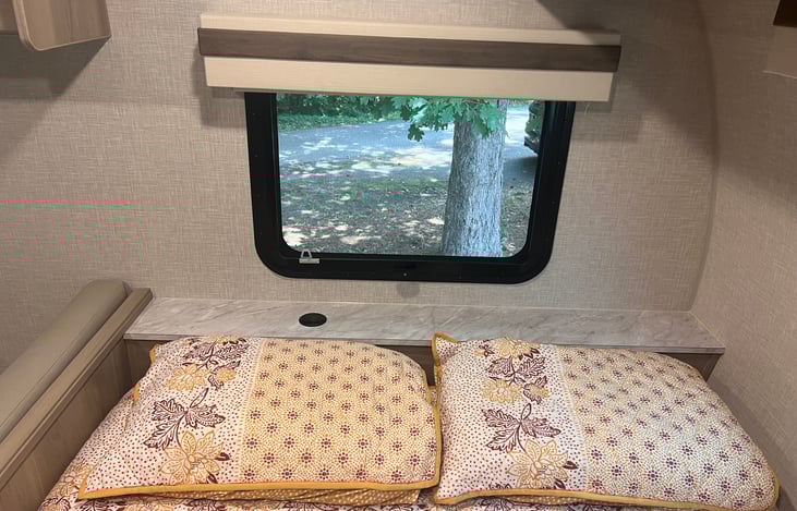 Queen bed. There is a power/USB port pop-up on the headboard.