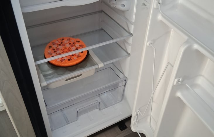 Nice size refrigerator. 1/2gals work best! Very small freezer.