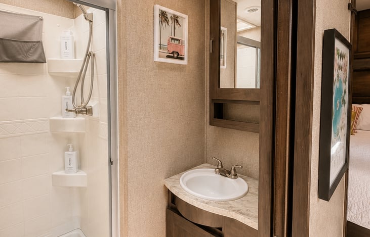 Full size bathroom shower and vanity