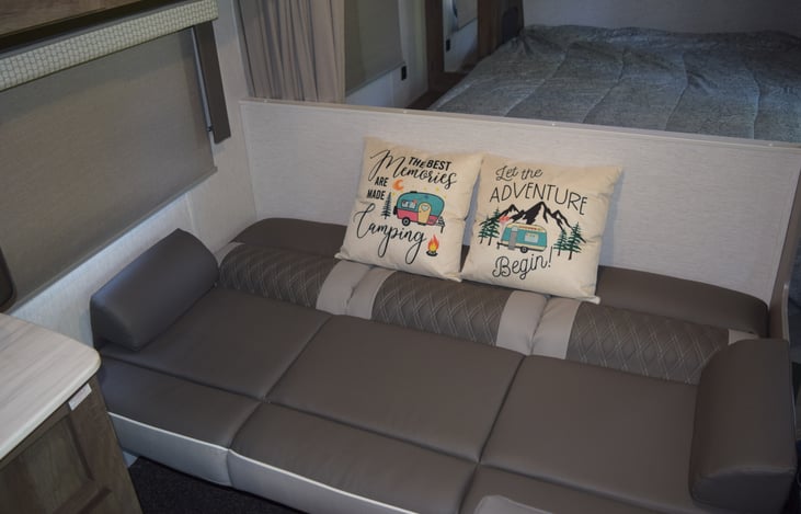 Sofa converted to a bed.