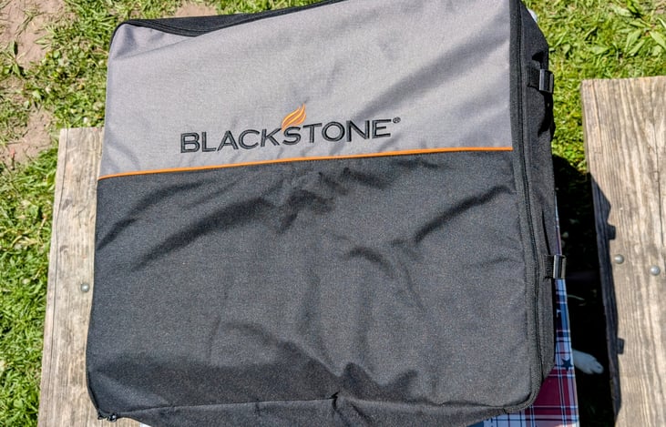 Blackstone with case and grilling utensils/tools. (Check out add-ons)