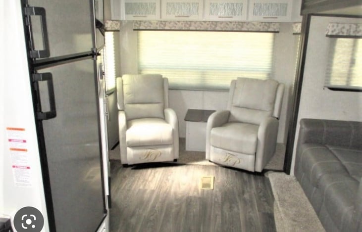 Recliners and couch. Television is directly across from the couch ( not seen)