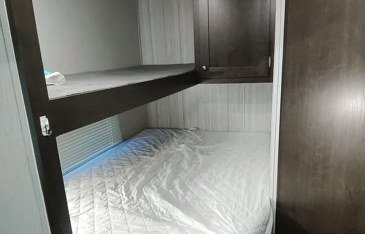 Bunks: Twin'ish on top and Double (Ish) on bottom. Extra thick mattress on the bottom!