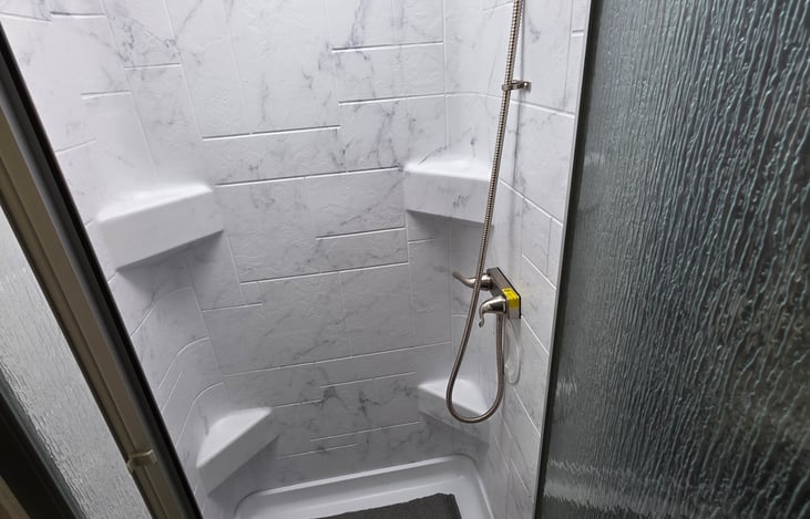 Split bathroom for more space.  The toilet door can open into the hallway to create a private shower and toilet sink space. Shower can accommodate heights over 6 ft.