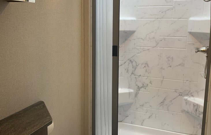 Bathroom with Sink, Mirror, Toilet and Shower