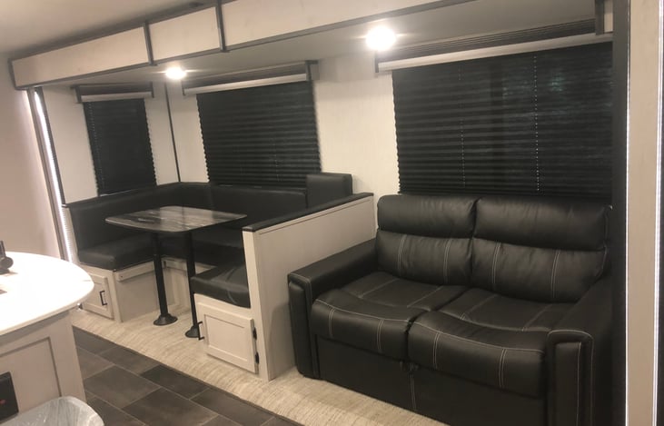 Table folds out to bed, couch slides out to bed.