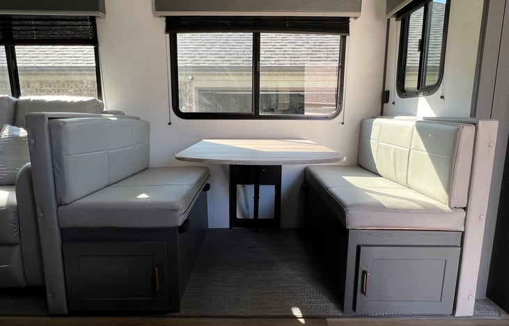 Four person dinette also converts to a bed comparable to a twin size. Comfortably sleep one adult or two small children. Large storage compartments located under dinette benches.