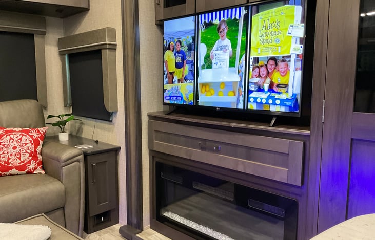 Smart TV in the media center above the fireplace.