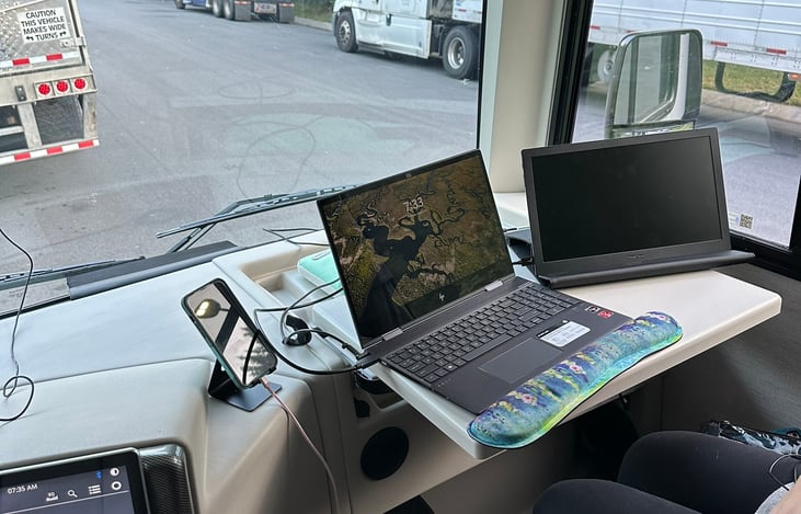 Workspace at the passenger seat with an outlet and inverter.  great space to work on the road