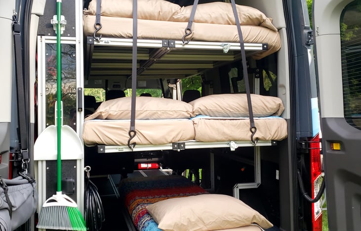 Two double bunks with single mattress on the floor
Upper bunk and mattress on floor are 6' long, middle bunk is 5'