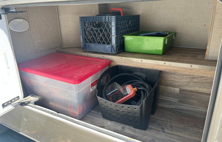 Waste Hose (x2) with clear elbow support stand, Shore Power Cable with Surge Protector w/adapters, Water-hose (x2) w/Filter, Wheel Chocks