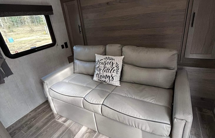 The bed coverts to a sofa. Sofa also has storage underneath.