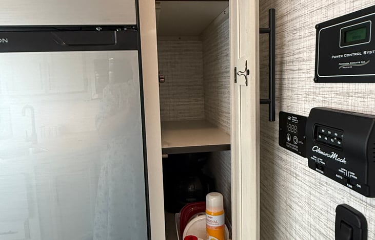 Pantry next to fridge. Nice place to store food and supplies.