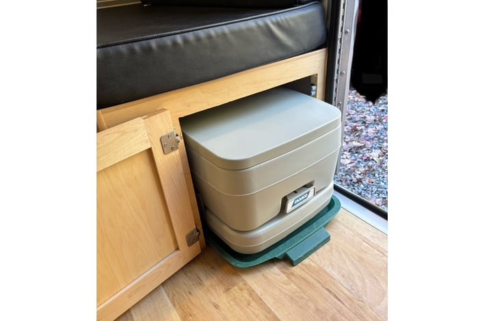 Cassette porta-potty under bench seat