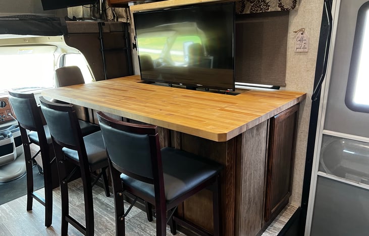 Bar area with TV fully lifted.  Watch TV while dining.