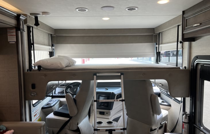 Over cockpit queen bed