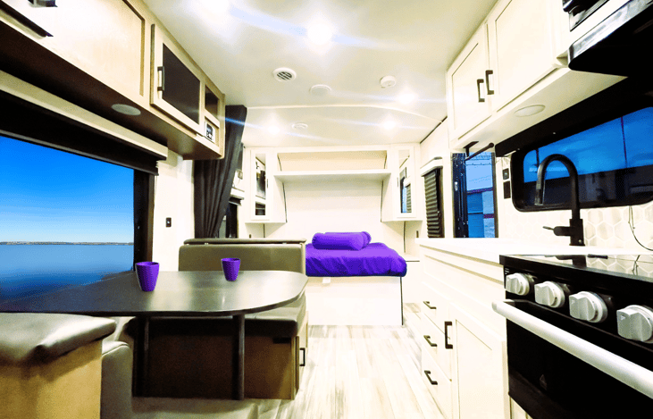 Spacious and modern interior of our Jayco Jay Flight — this Jam Caravan blends functionality and comfort. RV rentals made easy with Enjoy Your Trailer!
