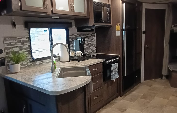 FULLY STOCKED KITCHEN, COFFEE MAKER, DISHES, TOWELS, POTS N PANS, SILVERWARE