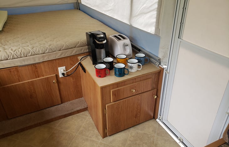 Keurig, toaster and coffee mugs