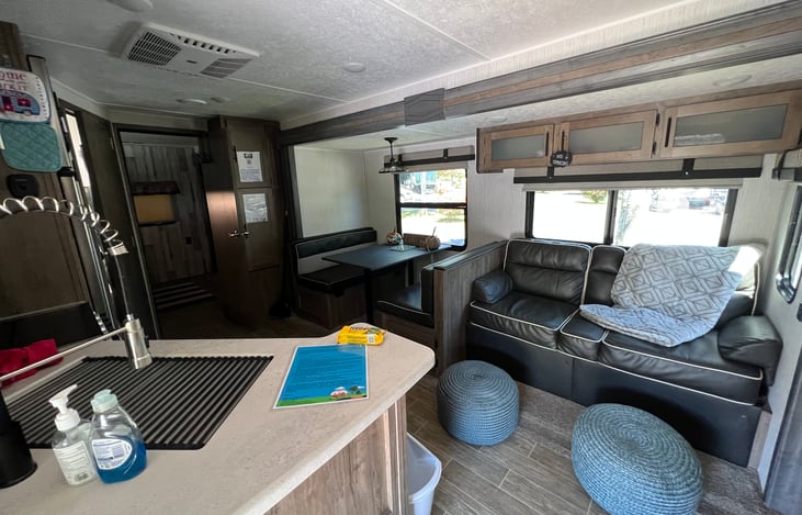 Living room w/ added stools for a comfortable rest