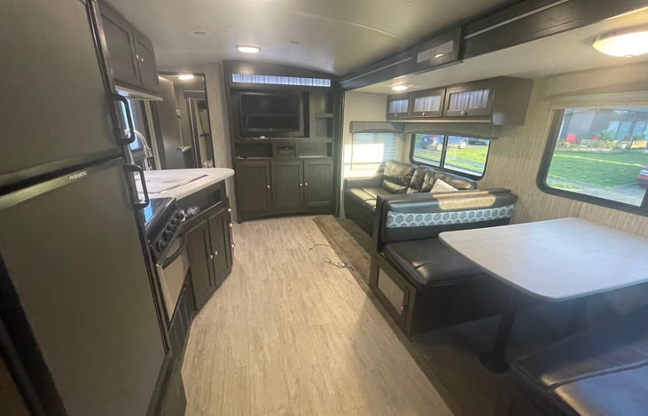 Full kitchen with dinette. Large TV (bring your HDMI device!) with plenty of DVDs included as well as board games. Couch folds down to sleep up to 2 people.