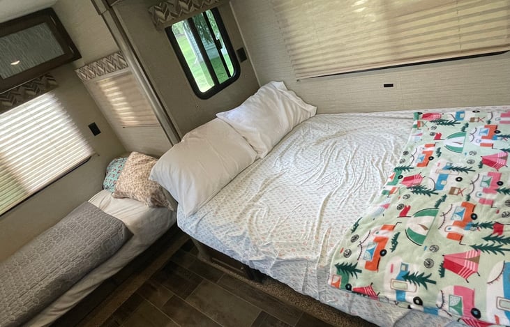 Sofa and dinette functioning as beds. This area sleeps 4, but the sofa is best for smaller children. We will include a mattress topper for extra cushion for the dinette!