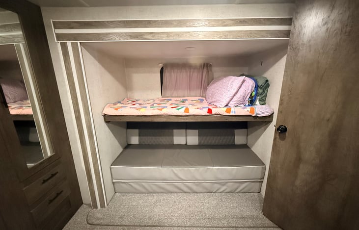 Twin bed above a foldout couch (Queen bed)