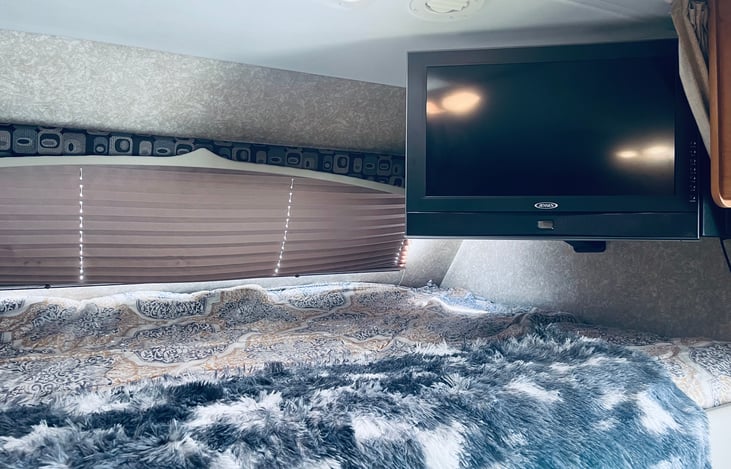 Above the cab bed ( larger than a queen size)