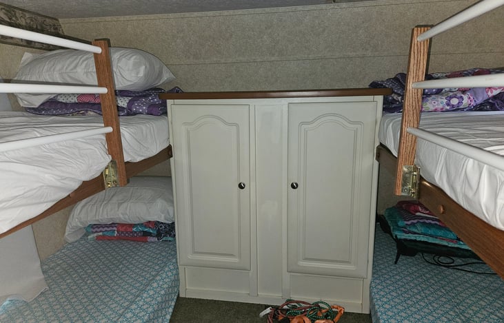 Sleeps 4, with top rails to keep kids safe, beds come with sheets and pillows