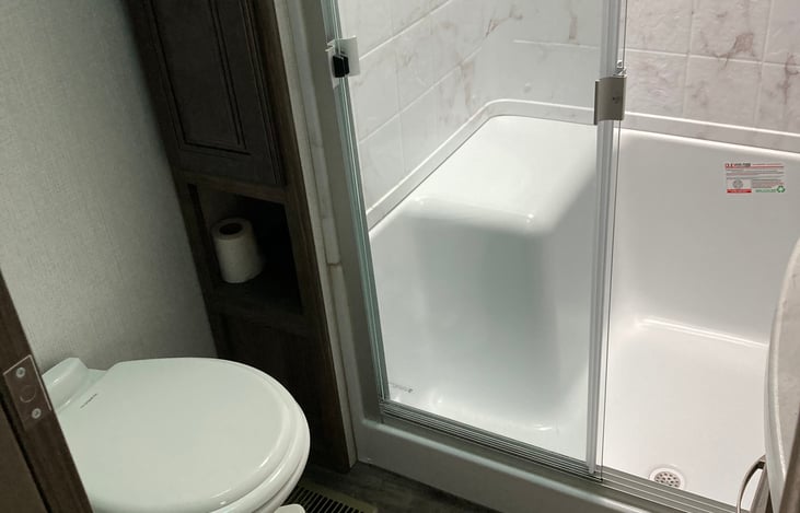 Bathroom includes a roomy shower.