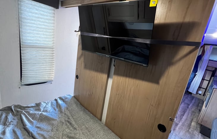 32 inch smart tv mounted in the bedroom