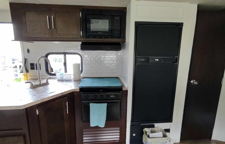 Full kitchen with large refrigerator