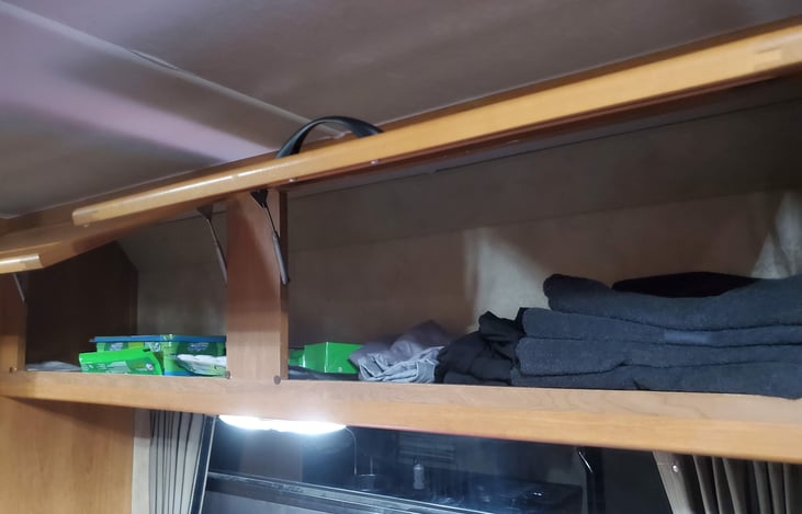 Storage compartments stocked with towels for each traveler.