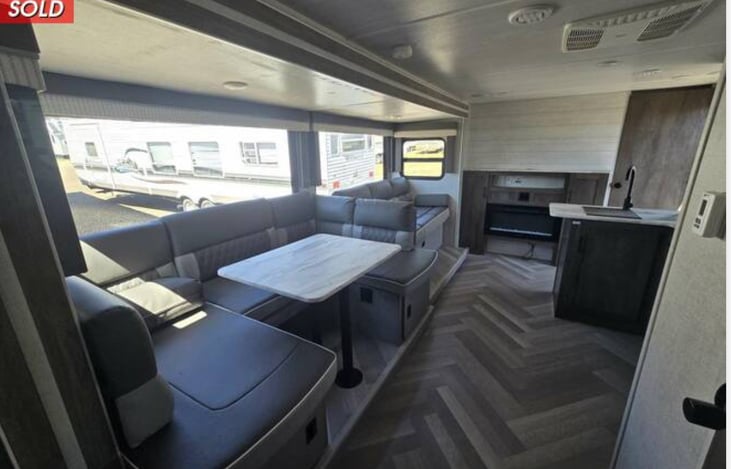 Dinette, living room area, and fire place with ambience or real heat settings. Bluetooth radio with indoor and outdoor speakers.