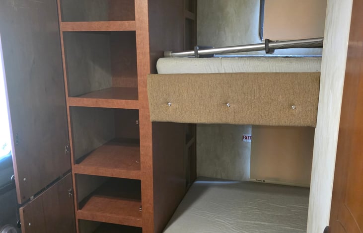 Twin bunk beds with storage shelves