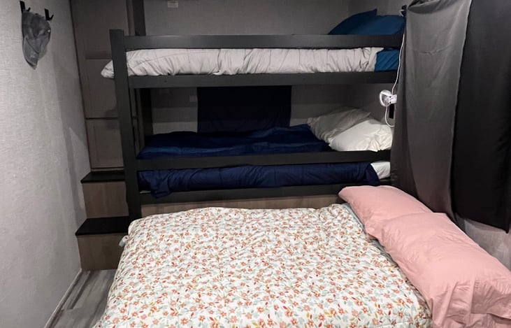 Full size bunks with full size convertible couch.