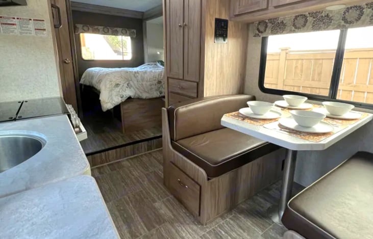 Dinette converts to 68" long twin, and houses the 2 other seatbelts for up to 4 riding guests.