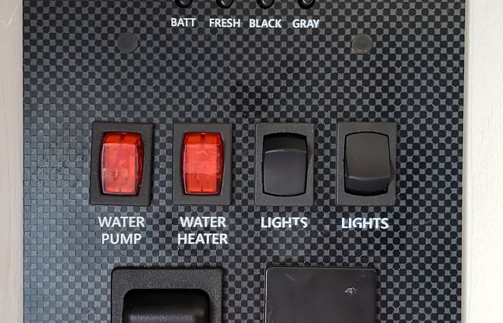 Tanks check lights & automatic awning switch.