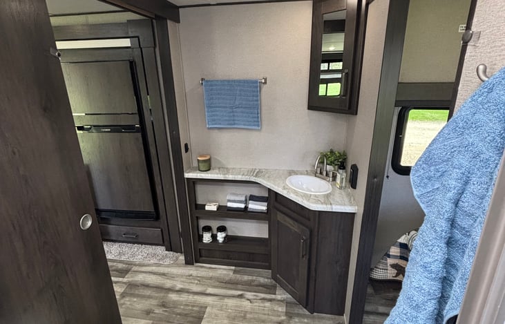 Spacious bathroom with plenty of storage area and counter top space.