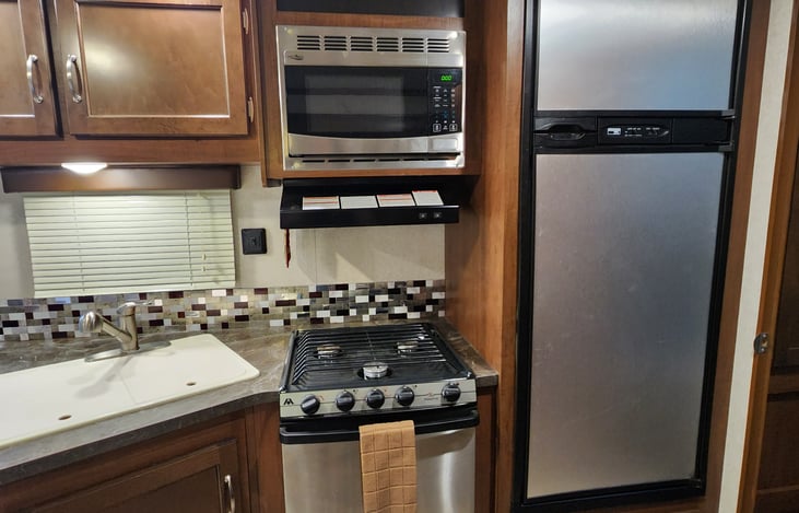 range, oven, microwave, fridge with seperate freezer