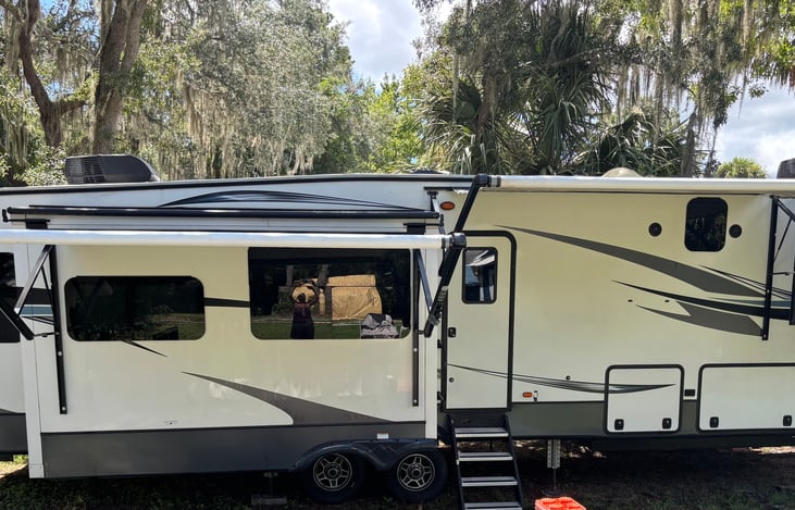 Front side of RV with both awnings out